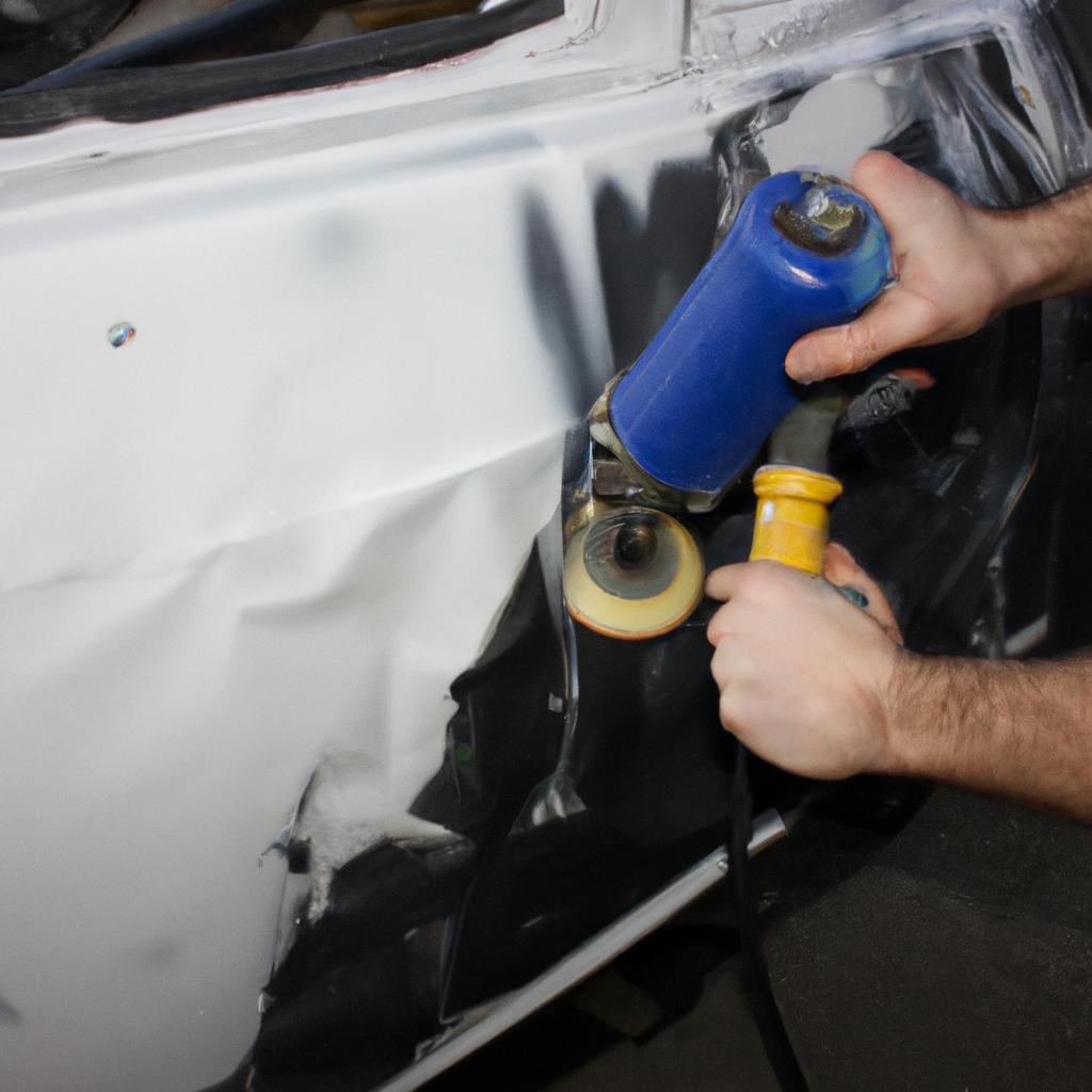 Person performing auto body repairs